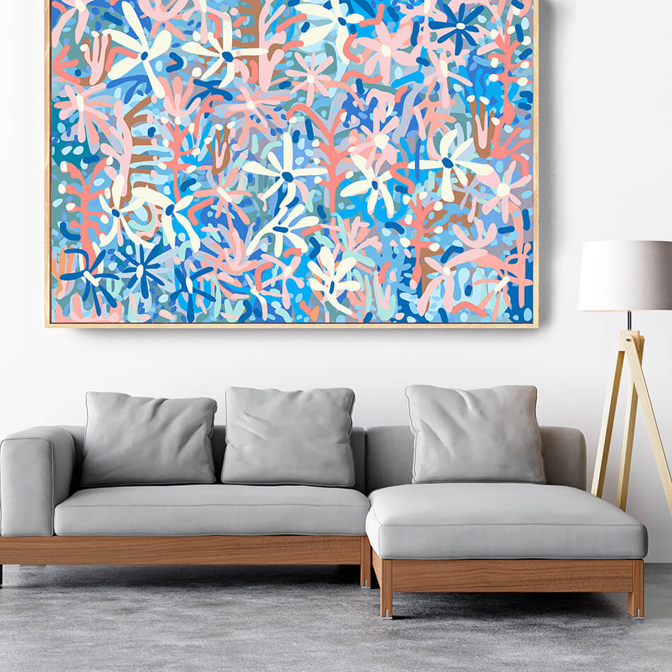 Modern living room with a gray sectional sofa and a colorful abstract painting on the wall.