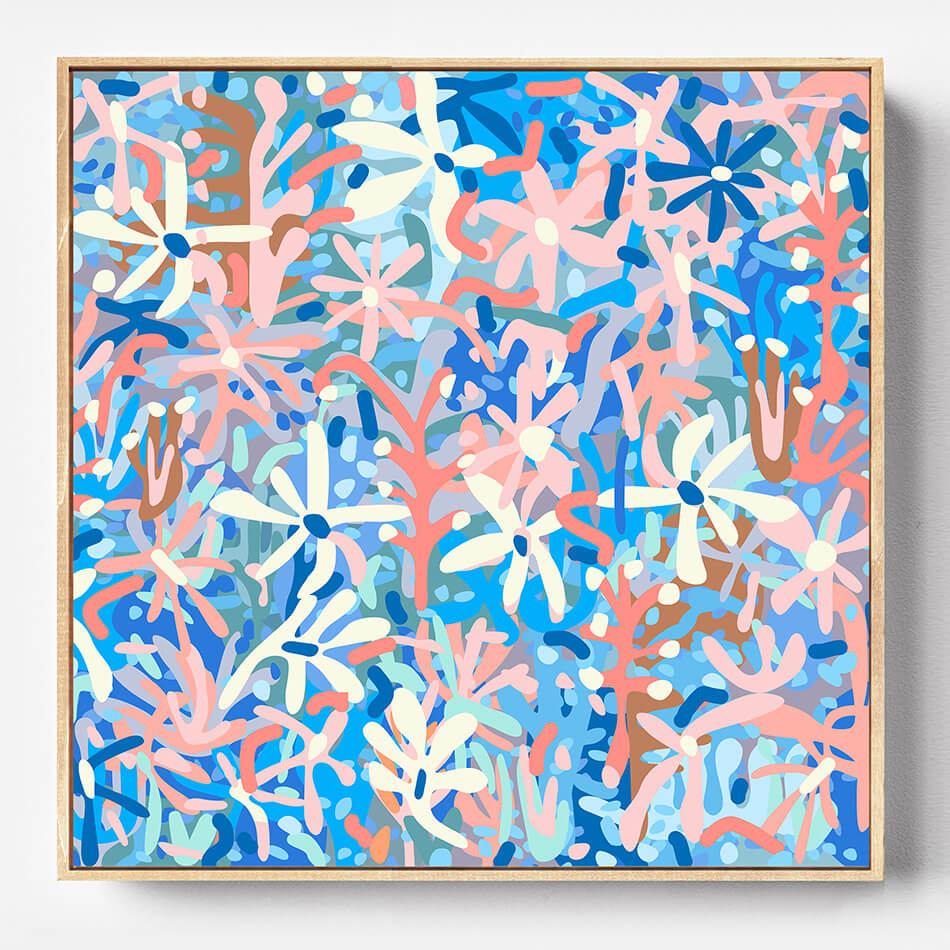 Framed abstract artwork with pink, blue, and white floral patterns on a blue background.